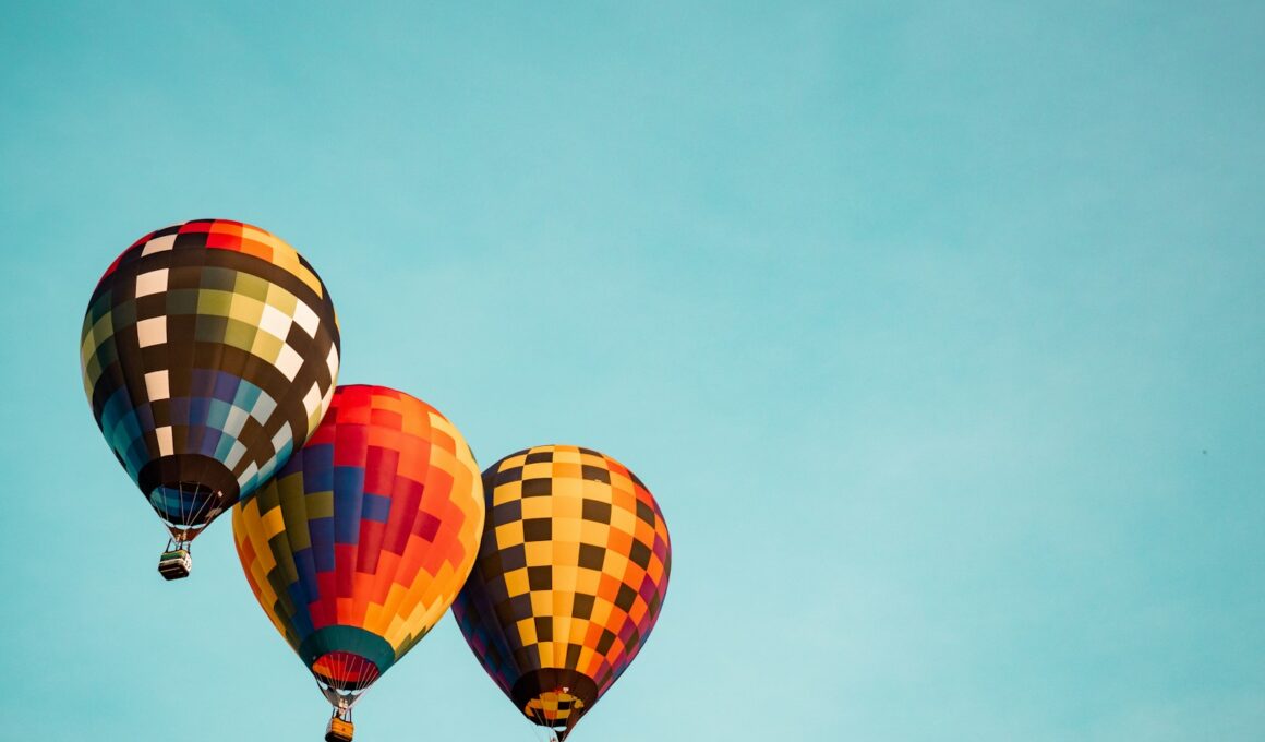 three flying hot air balloons